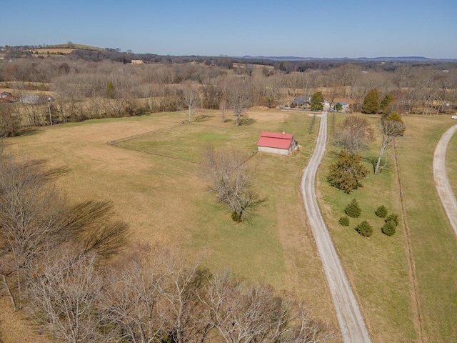 birds eye view of property with a rural view