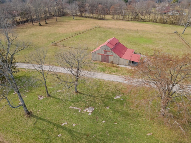 birds eye view of property with a rural view