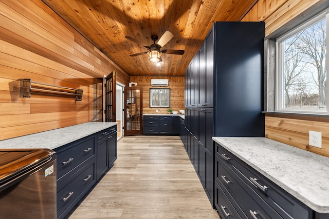 kitchen with stove, wood walls, wood ceiling, an AC wall unit, and light wood-type flooring