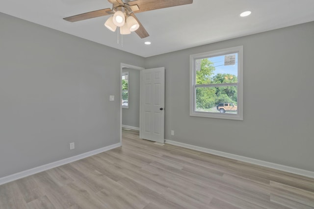 unfurnished room featuring ceiling fan, recessed lighting, light wood-type flooring, and baseboards