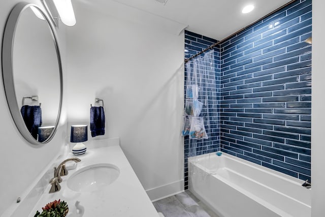 full bathroom featuring baseboards, shower / tub combo with curtain, and vanity