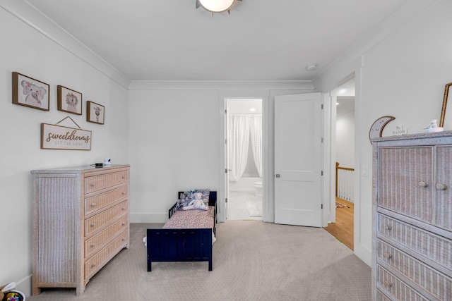 sitting room with carpet and ornamental molding