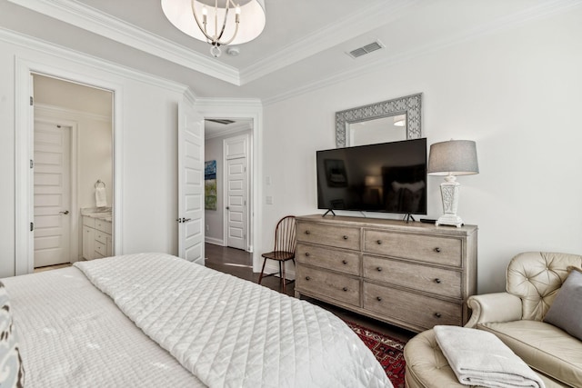 bedroom with dark wood-style floors, ornamental molding, a chandelier, and visible vents