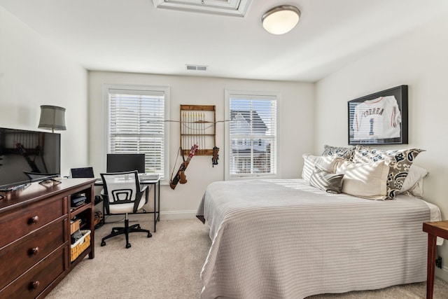 bedroom featuring light carpet, baseboards, and visible vents