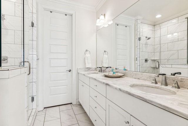 bathroom with a shower stall, marble finish floor, a sink, and crown molding