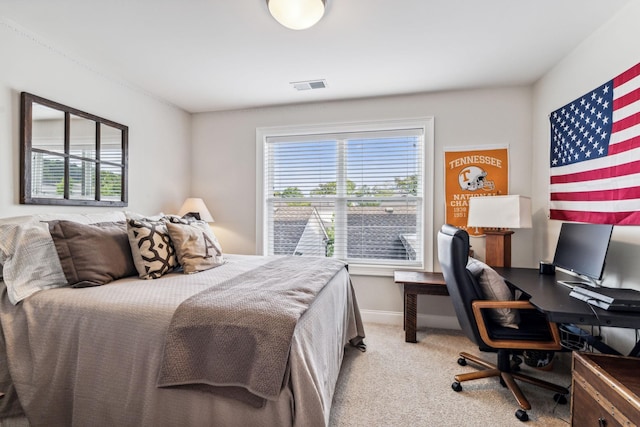 bedroom with light colored carpet, visible vents, and baseboards