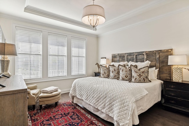 bedroom featuring crown molding and wood finished floors