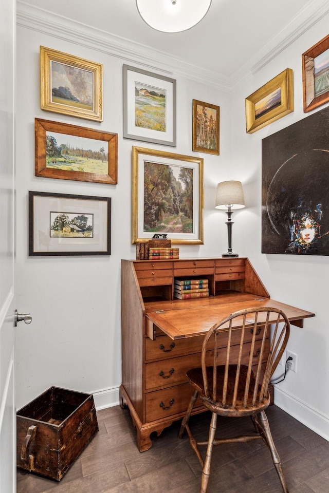 office area featuring baseboards, crown molding, and wood finished floors