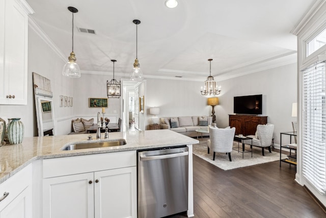 kitchen with a sink, white cabinetry, open floor plan, and dishwasher