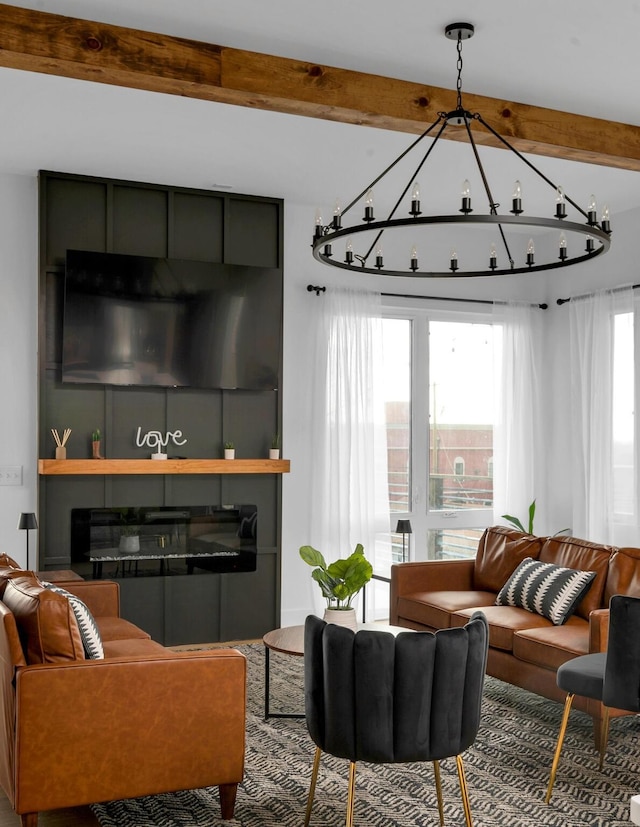 living area with a fireplace and beam ceiling