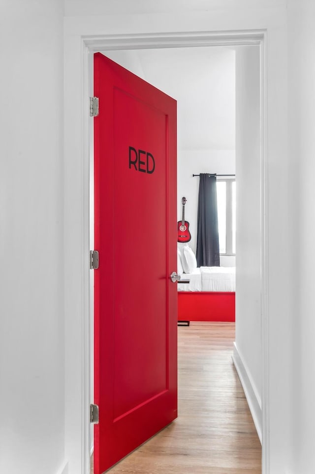 hallway featuring light wood-style floors