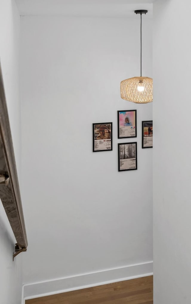 interior space featuring wood finished floors and baseboards