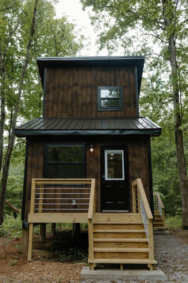 view of front of property with metal roof and board and batten siding