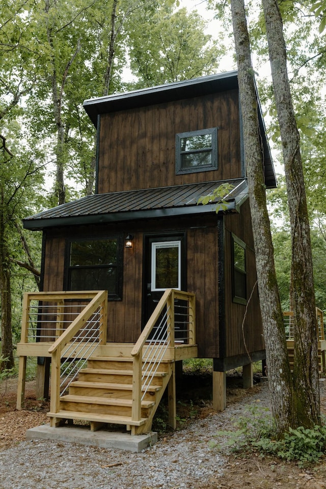 exterior space featuring metal roof and board and batten siding