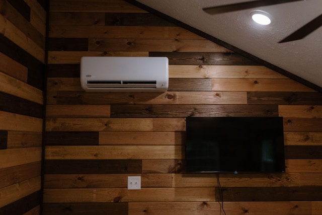 details featuring wood walls and a wall unit AC