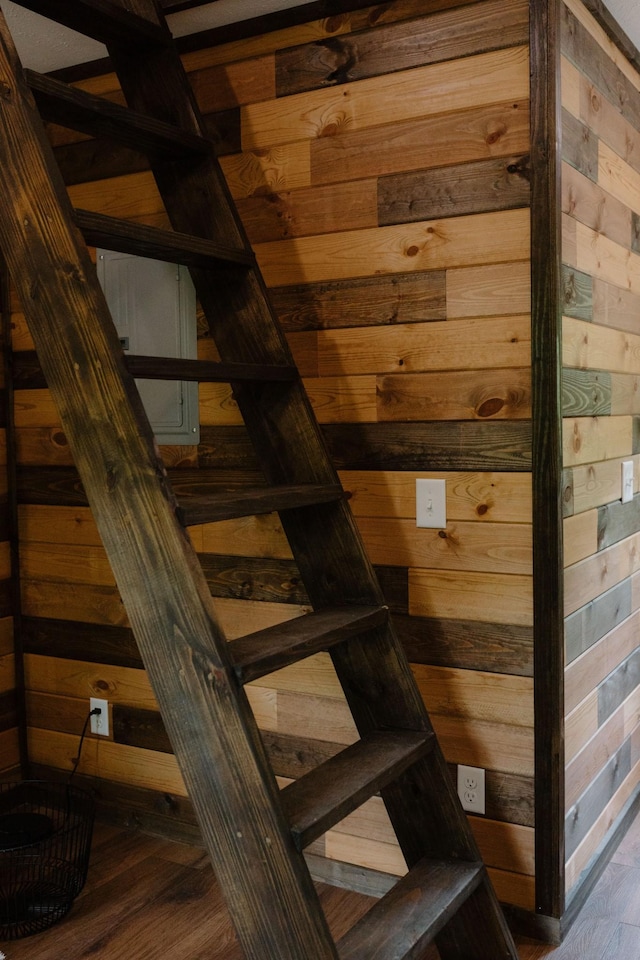 staircase with wood finished floors