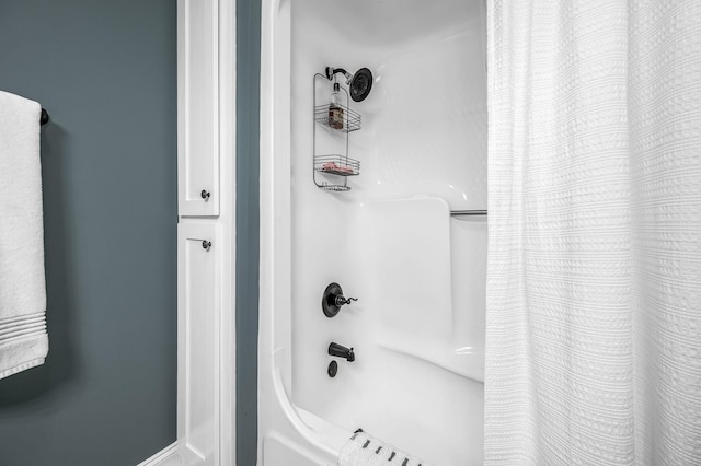 full bathroom with shower / tub combo with curtain