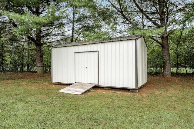 view of shed with fence