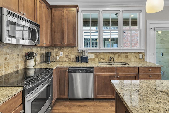 2112 Acklen Ave Unit 201, Nashville, TN 37212 - kitchen with light stone countertops, appliances with stainless steel finishes, backsplash, and a sink