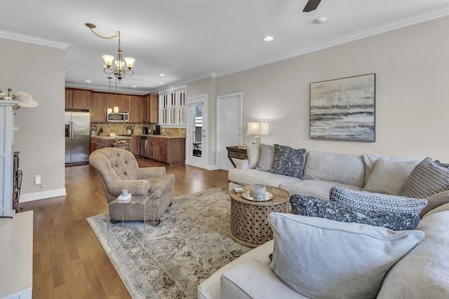 2112 Acklen Ave Unit 201, Nashville, TN 37212 - living area featuring baseboards, recessed lighting, wood finished floors, and crown molding
