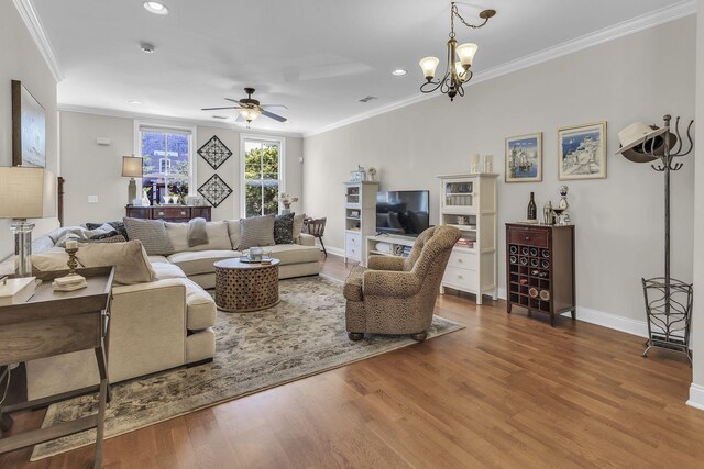 2112 Acklen Ave Unit 201, Nashville, TN 37212 - living area featuring baseboards, ornamental molding, wood finished floors, ceiling fan with notable chandelier, and recessed lighting