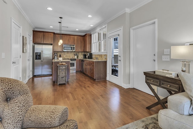 2112 Acklen Ave Unit 201, Nashville, TN 37212 - kitchen with open floor plan, wood finished floors, light stone countertops, stainless steel appliances, and pendant lighting