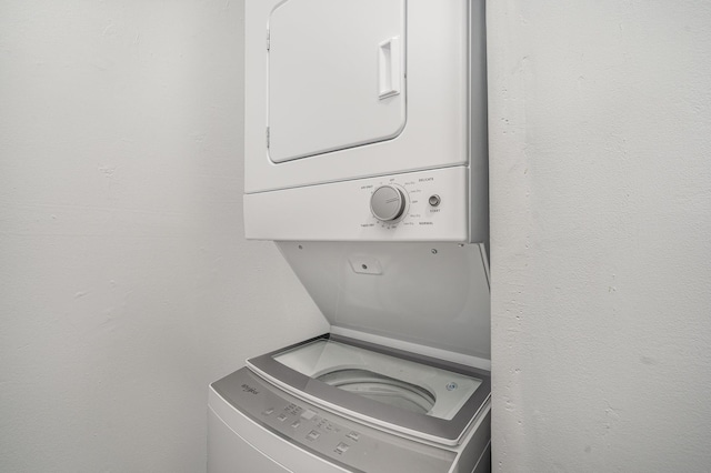 laundry area featuring laundry area and stacked washing maching and dryer