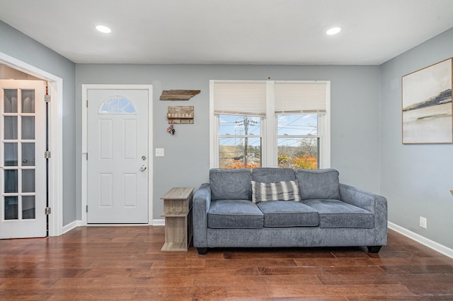 sitting room featuring baseboards, wood finished floors, and recessed lighting