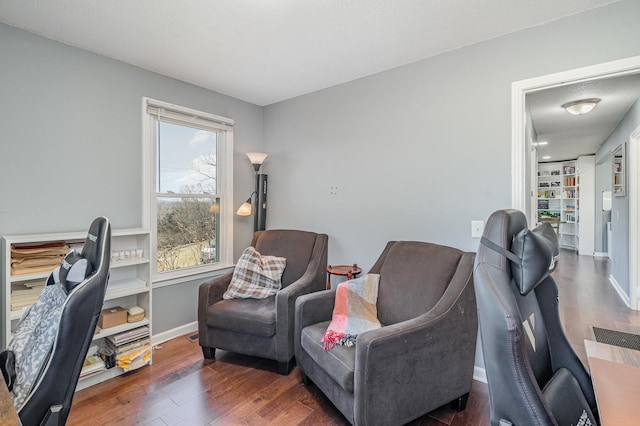 office featuring baseboards and wood finished floors