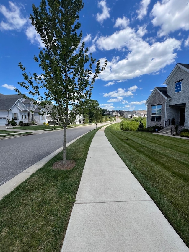 view of street with a residential view and sidewalks