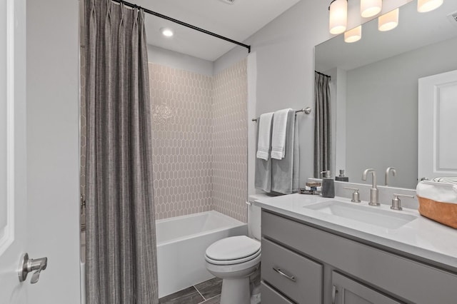 bathroom with shower / tub combo, visible vents, vanity, and toilet