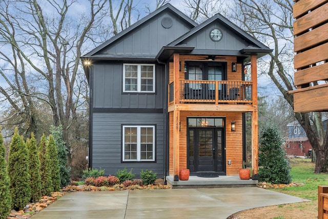 view of front of house with a balcony and board and batten siding