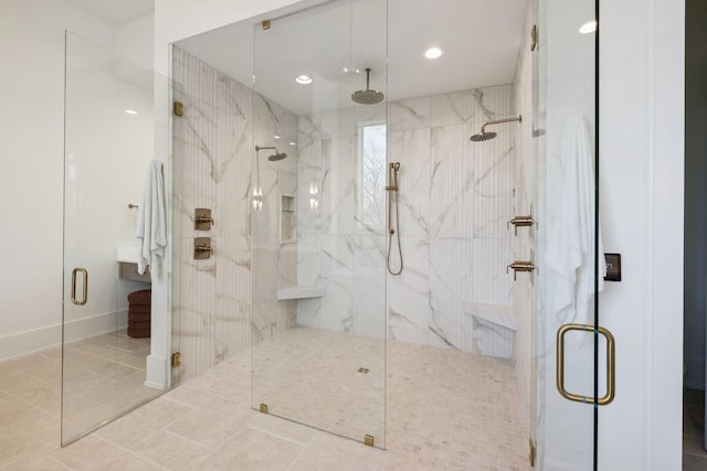 bathroom featuring recessed lighting and a marble finish shower