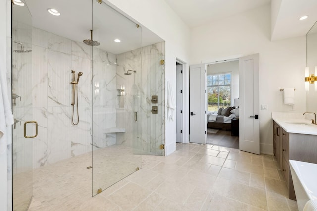 bathroom featuring ensuite bath, a marble finish shower, vanity, and recessed lighting