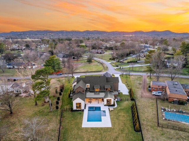 aerial view at dusk with a mountain view