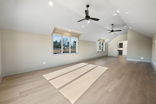 bonus room with visible vents, a ceiling fan, vaulted ceiling, light wood-type flooring, and baseboards