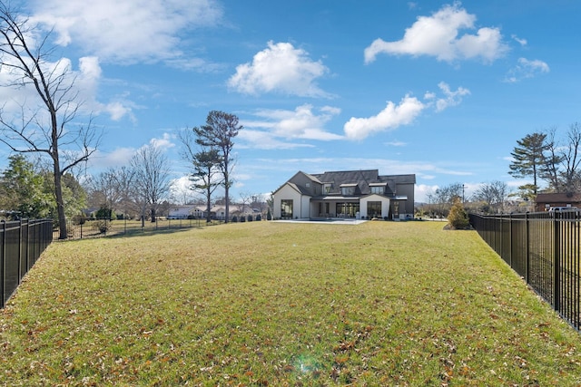 view of yard with a fenced backyard