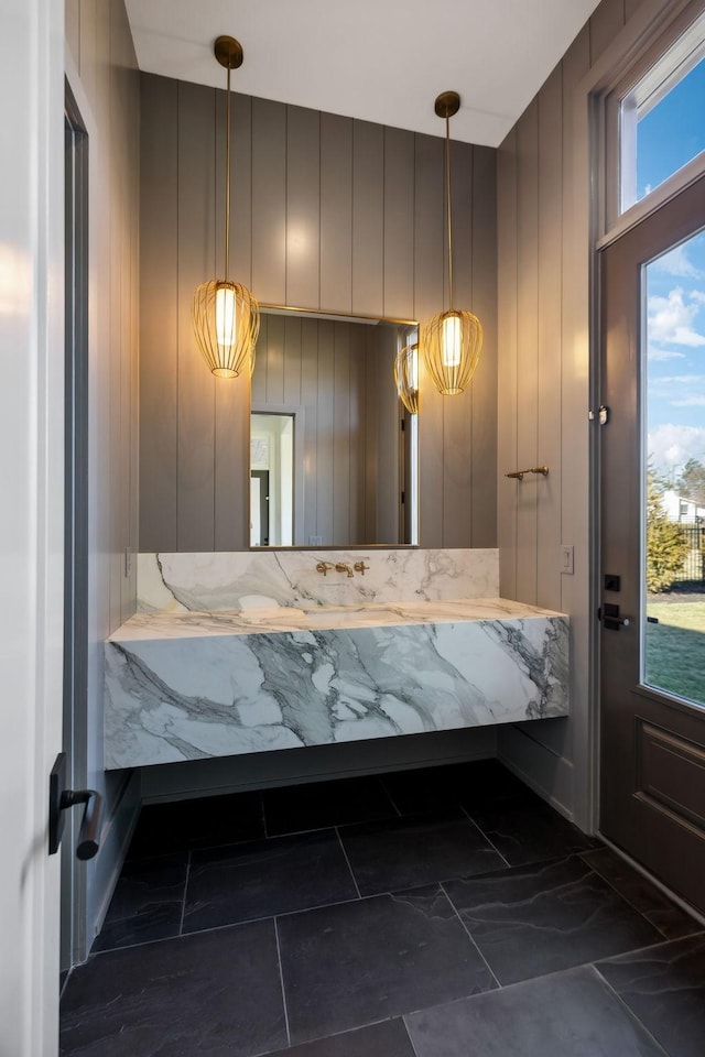 bathroom with marble finish floor