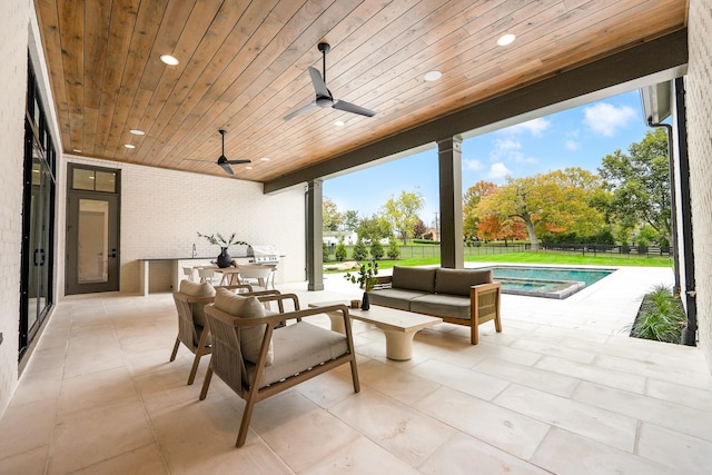 view of patio featuring a fenced in pool, fence, an outdoor hangout area, and a ceiling fan