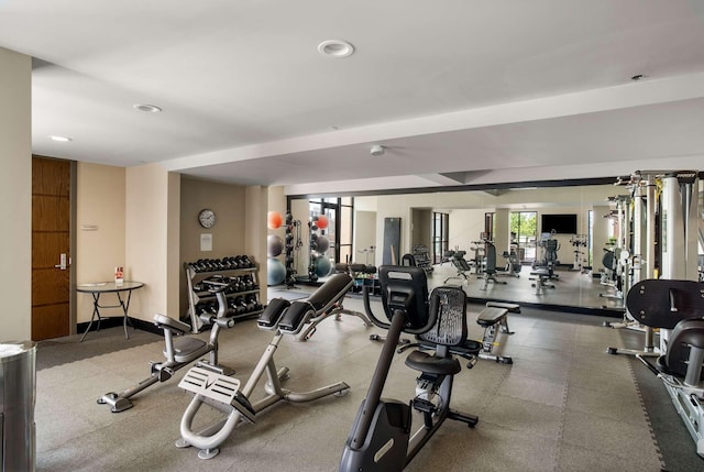 workout area featuring baseboards and recessed lighting