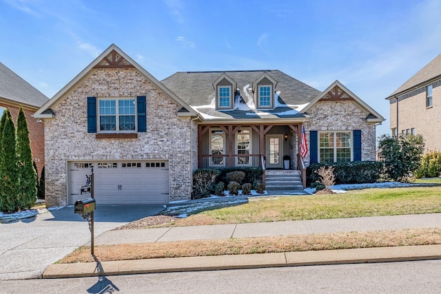 view of front facade with a garage, a porch, concrete driveway, and brick siding