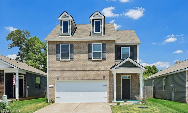 view of front facade featuring driveway, an attached garage, a front yard, and brick siding