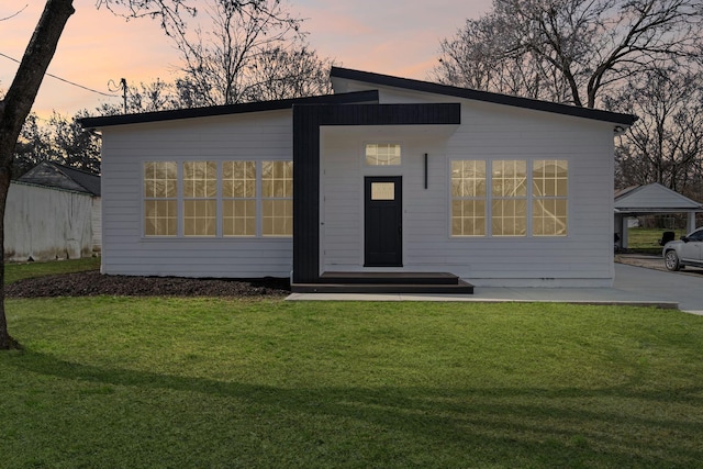 view of front of home with a front lawn