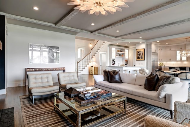 living area featuring stairs, beam ceiling, dark wood-style flooring, and a notable chandelier