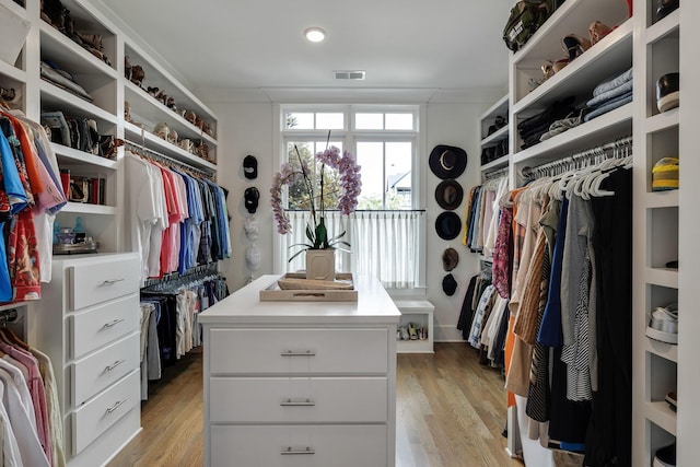 walk in closet featuring visible vents and light wood-style flooring