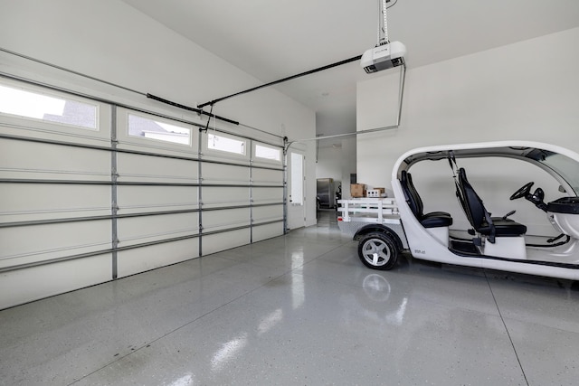 garage featuring a garage door opener