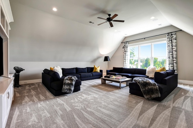 living area with lofted ceiling, visible vents, baseboards, and light colored carpet