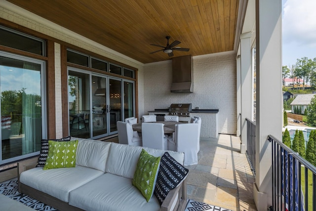 view of patio / terrace featuring a ceiling fan, area for grilling, a balcony, a grill, and outdoor dining area