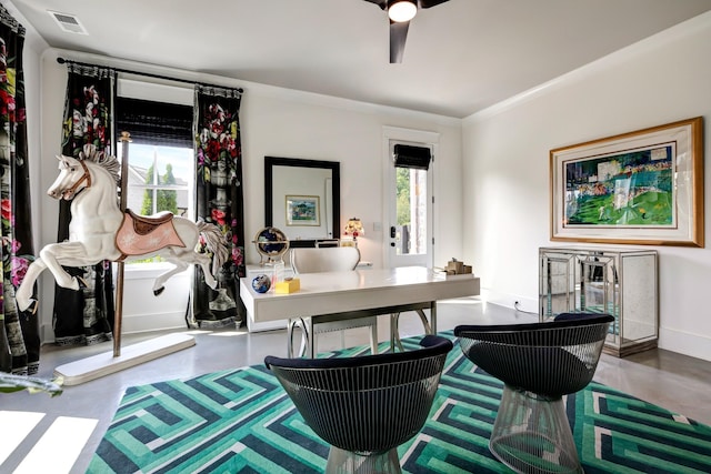 office area featuring finished concrete flooring, baseboards, visible vents, and a ceiling fan