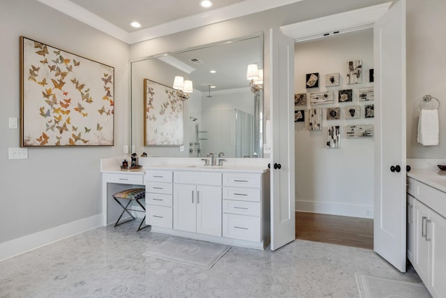 bathroom with recessed lighting, baseboards, ornamental molding, and vanity